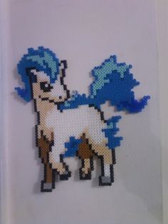 an image of a pixelated pony with blue hair