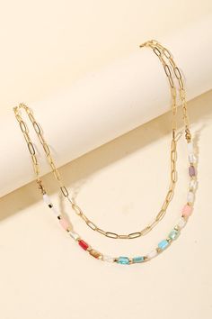 Double layered chain beaded necklace Approximate length: 16 inches with 2 inch extender all accessory items are final sale and not eligible for return or exchange. Trendy Multi-strand Layered Chain Necklace, Trendy Multi-strand Charm Necklaces, Trendy Multi-strand Metal Charm Necklaces, Double Strand Colorful Beaded Necklaces For Layering, Trendy Multi-strand Metal Chain Necklace, Layered Multi-strand Metal Charm Necklaces, Trendy Metal Multi-strand Chain Necklace, Trendy Multi-strand Colorful Beaded Necklaces, Trendy Multi-strand Necklace With Colorful Beads