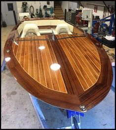 a wooden boat being built in a shop