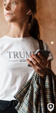 Pair your white "Trump 2020" tee with jeans and a flannel! We’re not confused by the endless barrage of leftist propaganda - we voted for Trump again in 2020. We support and respect Donald Trump, and with this cute Trump 2020 shirt, we’ll look good doing it! Tags: Women's Trump Shirts, Women for Trump, Conservative T-Shirts #conservative #trump #republican Shirts Women, Outfit Idea