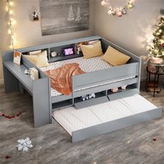 a child's bed with drawers underneath it and christmas lights on the wall above