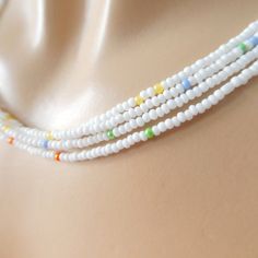 "Unique white necklace with a sprinkle of color in it. Please see pictures and note this is not plain white. It as some color beads throughout, but is is a great accessory if you want something understated and subtle. The size shown in the picture is 16\". Please read specifications on SIZES below: ❤ SIZES This item comes in several sizes, kindly choose at checkout. The easiest way to find out which length suits you best is to measure a necklace you already own, from one end to the next, includi White Beaded Chain Dainty Jewelry, Delicate White Beaded Chain Jewelry, White Dainty Beaded Chain Jewelry, Dainty White Beaded Chain Jewelry, Delicate White Beaded Necklaces, Delicate White Beaded Chain Necklace, White Dainty Beaded Chain Necklace, White Dainty Beaded Necklace, Dainty White Jewelry With Tiny Beads