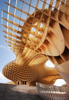 a large building with many different designs on it's side and stairs leading up to the top