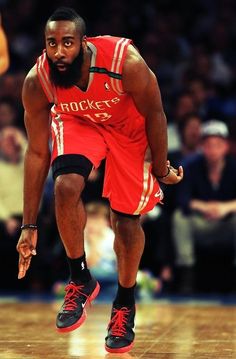 a basketball player dribbling the ball during a game