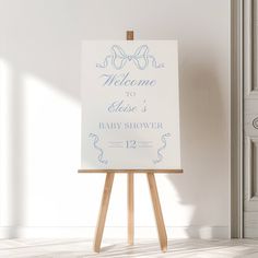 an easel with a welcome to baby shower sign on it