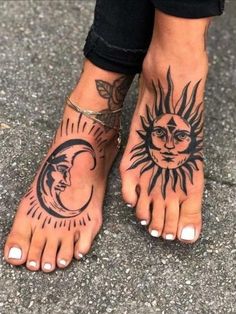 a person with sun and moon tattoos on their feet