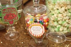 there are many different types of candy in glass containers