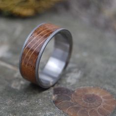 a wooden ring sitting on top of a rock