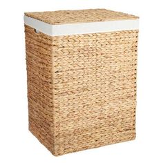 an empty wicker basket with white lid on a white background for use as a laundry hamper