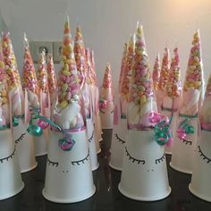 there are many hats made to look like unicorns with candy on their heads and ears