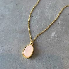 Introducing our new Simple Rose Quartz Necklace! This elegant necklace is made with a high-grade rose quartz gemstone, and is 18k gold plated for a luxurious look. Rose quartz is known as a metaphysical crystal, and it is a symbol of love, peace, and self-care. It's the perfect gift for yourself or a loved one and comes in a beautiful Asana jewelry box. Order now while supplies last!

 

 	Size: 18 inches
 	Free Shipping 2 Days
 	Authentic Pink Stone: Rose Quartz
 	18k Gold Plated Feminine Rose Gold Rose Quartz Necklaces, Rose Quartz Pendant Necklace In Rose Gold, Rose Gold Pendant Necklace With Rose Quartz, Feminine Gold Necklace With Gemstone, Feminine Gold Gemstone Necklace, Rose Quartz Healing Necklace, Rose Gold Crystal Necklaces With Rose Quartz Gemstone, Elegant Rose Quartz Crystal Necklace In Rose Gold, Rose Quartz Pendant Necklace With Gemstones