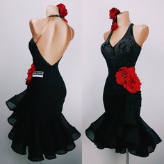 a dress with red flowers on the back and black ruffles at the bottom