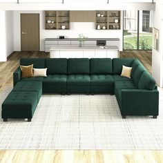 a large green sectional couch sitting in a living room