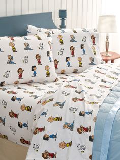 a bed with cartoon characters on it