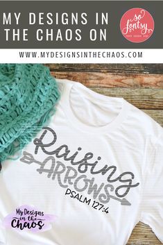 a t - shirt with the words, my designs in the chaos on it and a green scarf