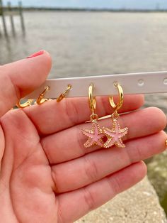 Starfish Huggies are perfect and there are multiple colors available! These hoops are hypoallergenic, nickel-free, and 18K gold plated so they are ideal for sensitive ears. Gold Starfish Earrings, Sea Star Earrings, Beachy Gold Jewelry, Beach Earrings Aesthetic, Gold Beachy Jewelry, Pink Starfish Charm Jewelry, Pink Star Jewelry With Starfish Charm, Pink Star-shaped Jewelry With Starfish Charm, Starfish Charm Hoop Earrings As Gift