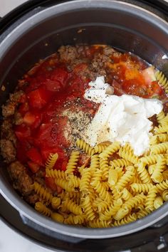 pasta, meat and sauce in the slow cooker ready to be made into an appetizer