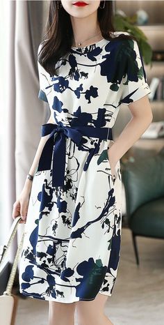 Aesthetic blue and white floral midi dress with long sleeves. For elegant and feminine women. Classy dress below the knee with short sleeves. Spring A-line Dress With Belt, White Summer Midi Dress With Tie Waist, White Midi Dress With Tie Waist For Summer, Summer Knee-length Dress With Belt, White Short Sleeve Maxi Dress With Tie Waist, Casual Knee-length Belted Dress, White Maxi Dress With Tie Waist And Short Sleeves, Casual Knee-length Dress With Belt, Belted Office Dress For Spring