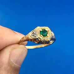 * Gorgeous 14k Yellow Gold Round Cut Emerald Diamond Regal Womans Ring Size 6.75 * Metal: 14k Yellow Gold * Stone(s): (1) Round Cut Emerald, (2) Round Cut Diamond * Emerald measures approximately 3.15 mm * Diamonds measure approximately 1.30 mm each * Ring Size: 6.75 * Length: 7/8" * Band Width: 1.50 mm * Weight: 2.5 tgw * Markings: 14k * Makers Mark * Condition: As pictured.  * G2078    Exported By ExportYourStore :) Antique Gold Round Emerald Ring, Victorian 14k Gold Round Emerald Ring, Antique Emerald Ring In 14k Yellow Gold, Vintage 14k Gold Emerald Ring With Polished Finish, 14k Gold Emerald Ring With 17 Jewels, Round Cut, Emerald Diamond, Round Cut, Round Cut Diamond, Ring Designs