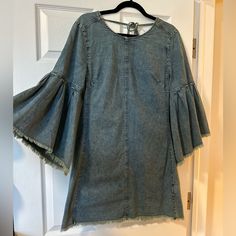 You Will Feel Like A Denim Princess In This Cute Free People Dress. The Sleeves Are Magic. Size 10 But Could Fit An 8. Dress Up With Fun Belt And Boots Or Just Let It Drape On Your Body With The Wonderful Low Back Cut In The Back. Fitted Long Sleeve Denim Dress With Frayed Hem, Fall Denim Dresses With Frayed Hem, Dark Wash Long Sleeve Washed Dress, Fitted Spring Dress With Frayed Hem, Medium Wash Mini Dress With Frayed Hem For Spring, Fitted Dress With Frayed Hem For Spring, Spring Medium Wash Mini Dress With Frayed Hem, Spring Casual Bell Sleeve Dresses, Casual Long Sleeve Dress With Frayed Hem