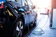 an electric car plugged in to a charging station