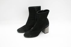 Elevate your style with our Black Suede leather Ankle Boots, exquisitely crafted in Italy for the discerning woman. These stunning boots feature a sleek design with high block beaded heels that add both height and elegance to your ensemble. The side zippers ensure easy wear, while the heels are embellished with small silvery studs for a touch of glamour. Made with premium suede, these boots exude luxury and sophistication with every step. Whether paired with jeans for a casual day out or a dress Beaded Heels, Womens Booties, Booties For Women, Embellished Heels, Booties Ankle Boots, Leather Ankle Boots, Easy Wear, Boot Shoes Women, Black Suede