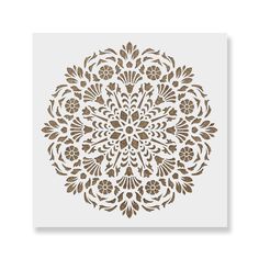 a white and brown paper with an intricate design on it