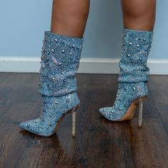 This Fierce Bootie Is Made From A Washed Denim Upper And Features A Mid Calf-Height Shaft, A Slightly Slouched Design, A Cushioned Insole, A Pointed Toe Silhouette, Scattered Iridescent Rhinestone And Spike Detailing, And A Rhinestone-Detailed Metal Stiletto Heel. Complete With A Slip-On Fit. Brand New. In Original Box. Heel Height Approximately 4.25” Blue Pointed Toe Boots With Rhinestones, Blue Rhinestone Boots With Pointed Toe, Blue Rhinestone Pointed Toe Boots, Light Blue High Heel Party Boots, Blue Rhinestone Boots For Fall, Light Blue Party Boots For Fall, Blue Boots For Spring Night Out, Blue Boots For Night Out In Spring, Spring Blue Boots With Rhinestones