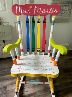 a child's wooden rocking chair made out of crayons