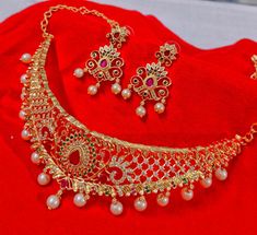 Gold Plated South Indian Style Choker Necklace Set With Chandbali Earring Premium Quality American Diamond Bridal Wedding Jewellery Set  you can wear your jewellery with confidence, knowing that each Electrifying Jewellery piece comes with a manufacturing warranty and a satisfaction guarantee. MATERIAL: Environmental Brass Alloy with Top Quality Genuine Plating, World-class Craftsmanship, TSB Collection makes people remember not only the jewellery itself, but also the woman who wears that jewellery. JEWELLERY CARE: It is advisable to store jewellery in a zip lock pouch (air tight pouch), keep away from water perfume and other chemicals and clean it with dry and soft cloth. LUXURY GIFTING IDEA: Give a meaningful and luxurious gift with Peora Jewellery. A favourite gift choice, each Peora je Bridal Wedding Jewellery, Wedding Jewellery Set, South Indian Style, Chandbali Earrings, Choker Necklace Set, Wedding Bridal Jewellery, American Diamond, Jewellery Set, Wedding Jewellery