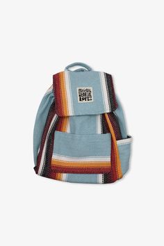 The Senor Lopez Originals backpack is the perfect on-the-go pack to carry all of the important items in your life. All of our backpacks are made from recycled t-shirt fabrics that would have otherwise been thrown in the dump. – Teal/Red/Yellow/Black/White– Pre-shrunk– Machine washable– 50% cotton, 25% polyester, 25% acrylic– Made in Mexico. Blue Cotton Backpack For Daily Use, Blue Cotton Backpack For Travel, Blue Cotton Backpack For Everyday Use, Functional Cotton Backpack For Back To School, Blue Cotton Standard Backpack, Casual Blue Backpack With Water Bottle Pocket, Functional Cotton Bags For Back To School, Casual Travel Bag Made Of Recycled Materials, Casual Travel Bag Made From Recycled Materials