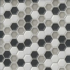 an image of a tile pattern that looks like hexagonals in grey and white