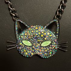 This Is A Gorgeous Piece From Betsy Johnson. Brand New With Tags Pendant Is A Large Cat Mask. The Eyes Are Supposed To Glow In The Dark. It Is Covered In Jewels That Are Blue And Iridescent. The Chain, Cat Whiskers, And Inside Of Cat Ears Are All Pewter In Color, This Is A Real Statement Piece To Get Lots Of Attention. So If You Love Cats Or If You Want Something Great To Wear For Halloween This Is The Necklace For You. Trendy Cat Design Jewelry For Party, Trendy Cat Design Jewelry For Parties, Seahorse Necklace, Betsey Johnson Necklace, Flower Statement Necklace, Seahorse Pendant, Mask Necklace, Rhinestone Statement Necklace, Cat Whiskers