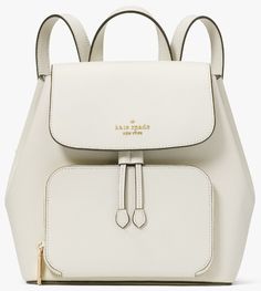 Kate Spade Kristi Medium Flap Backpack Ivory White Refined Grain Leather Color Code: parchment (100) New with Tags; Authenticity Guaranteed! KA695 / Retail $379 Note: black backpack image is posted for informational purpose our backpacks feature the most durable technical fabrics and soft leathers, and of course have a ton of space. oh, and like your outfits, they're super chic--because we think backpacks are meant for more than just algebra class and the gym. DETAILS Measurements 10.2" W x 9.6" Luxury Kate Spade Chic Leather Backpack, Kate Spade Handbags White, White Leather Bag, Flap Backpack, Script Logo, Ivory White, Black Backpack, Grey Leather, White Leather