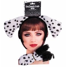 the dalmatian girl headband is black and white with polka dots on it