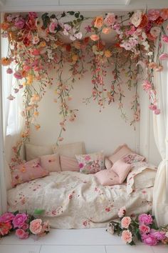 a bed covered in lots of flowers next to a window