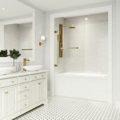 a white bathroom with two sinks and a bathtub