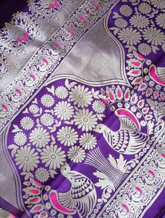 Fancy Silk Saree Purple colour with pink and silver combination with all over peacock motifs 🌟Saree: Fancy Silk 🌟 Saree color: Purple 🌟Border color: No border 🌟 Blouse: Purple with Silver buttas & border - unstitched & pic attached for reference 🌟 Occasion: Festival, Ceremony, Party Contact Us: Your satisfaction is important to us. Please feel free to contact us if you have any questions or need further information. Color Disclaimer: Please note that colors may vary slightly due to lighting and monitor settings. Anarkali Silver Saree With Traditional Drape, Silver Anarkali Saree In Traditional Drape, Silver Dupatta With Motifs For Festivals, Silver Semi-stitched Saree For Navratri, Navratri Silver Semi-stitched Saree, Silver Saree With Dupatta For Navratri, Silver Saree For Diwali Celebration, Silver Saree For Festivals And Celebrations, Silver Saree For Celebration And Festivals