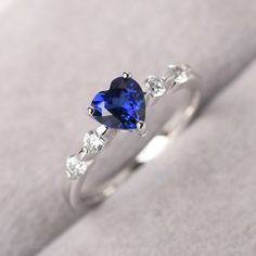 ◆ The ring is handcrafted from sterling silver and decorated with a dazzling 6*6 mm lab Sapphire and tiny CZs. It is suitable for engagement/anniversary/daily occasion. ◆ Production Description: Main stone Type: Lab Sapphire Main Stone Shape: Heart cut Main Stone Size: 6*6 mm(1.13 ct) Side stone: CZ Metal: 925 Sterling silver - Other options available in the drop down menu ◆ Customization: √Free for Add Engraving √Other Metal Type Available √Other Gemstones & Shapes Available √Personalizatio Sterling Silver Blue Sapphire Rings, Delicate Promise Rings, Promise Rings Sapphire, Proposal Sapphire Ring With Cubic Zirconia Accent Stones, Cubic Zirconia Brilliant Cut Birthstone Ring For Proposal, Cubic Zirconia Birthstone Ring For Proposal, Round Cut, Fine Jewelry Cubic Zirconia Sapphire Ring For Proposal, Cubic Zirconia Sapphire Proposal Ring, Cubic Zirconia Sapphire Ring For Proposal