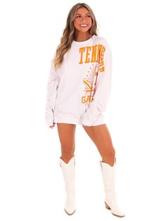 Show off your love for the Tennessee Volunteers with this long sleeve top featuring the team name down the sleeve. This jersey top is perfect for game day or everyday wear and will keep you comfortable with its long sleeves. Go Vols! White Athleisure Tops For Game Day, Collegiate Long Sleeve Tops For Sports Events, Long Sleeve Top With Team Name For Fall, Spring Varsity Long Sleeve Tops, Team-colored Tops For Sports Events In Fall, Varsity Tops For Fall Sports Events, Varsity Tops For Sports Events In Fall, Fall Varsity Style Tops For Sports Events, Varsity Style Tops For Fall Sports Events