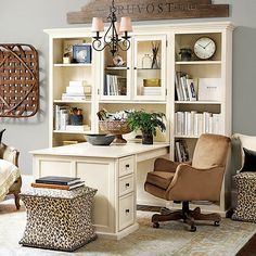 a home office with an animal print ottoman