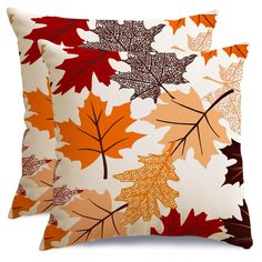 two pillows with autumn leaves on them