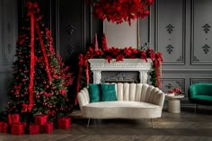 a living room decorated for christmas with red and green decorations