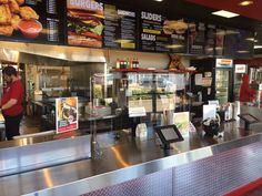 the inside of a fast food restaurant with menus