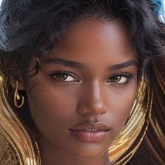 a close up of a woman with large earrings on her head and wearing gold jewelry