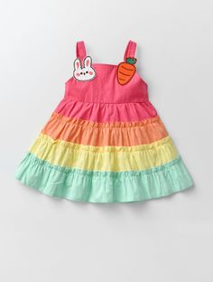 Dress your little one in this charming Baby Girl Rainbow Spring Tiered Dress, perfect for Easter festivities! This adorable dress features vibrant rainbow tiers and playful embroidered rabbits and carrots, adding a touch of whimsy to the holiday. Easter Festivities, Rainbow Springs, Girl Rainbow, Striped Bodysuit, Girls Stripes, Be A Nice Human, Girls Fashion, Tiered Dress