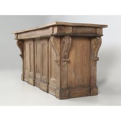 an old wooden cabinet with carvings on the front and sides, sitting against a white background