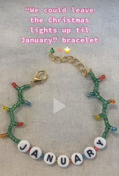 a beaded bracelet with the words january on it and an image of a christmas tree