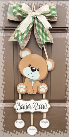 a door hanger with a teddy bear hanging from it's side and the words, center ourss