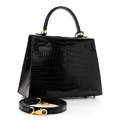 This is an authentic HERMES Shiny Porosus Crocodile Kelly Sellier 25 in Black. This elegant tote is crafted of exotic crocodile in black. This shoulder bag features a top handle, an optional detachable shoulder strap, a flap with a strap closure, polished gold plated hardware including a Kelly turn lock, a covered padlock, and a key clochette. The flap opens to a matching leather interior with zipper pocket and patch pockets. Kelly Sellier, Leather Interior, Patch Pocket, Top Handle, Zipper Pocket, Shoulder Strap, Gold Plate, Key, Turn Ons